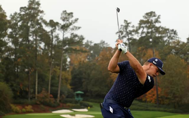 Bryson DeChambeau plays his shot from the 12th tee during a practice round prior to the Masters at Augusta National Golf Club. Picture: Patrick Smith/Getty Images
