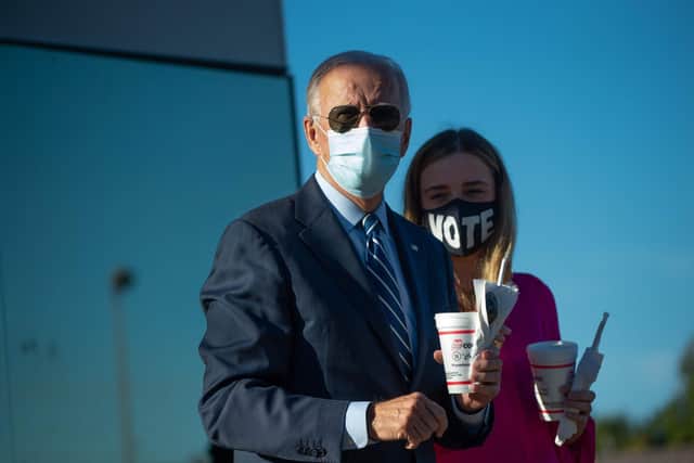 Joe Biden speaks to reporters after buying two milk shakes at local hamburger place in Durham, North Carolina (Picture: Roberto Schmidt/AFP via Getty Images)