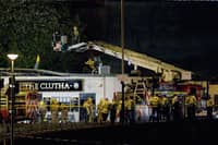 Rescue workers at the Clutha Bar in Glasgow after a Police Scotland helicopter crashed, killing all three crew and seven pub patrons. Picture: Jeff J Mitchell/Getty