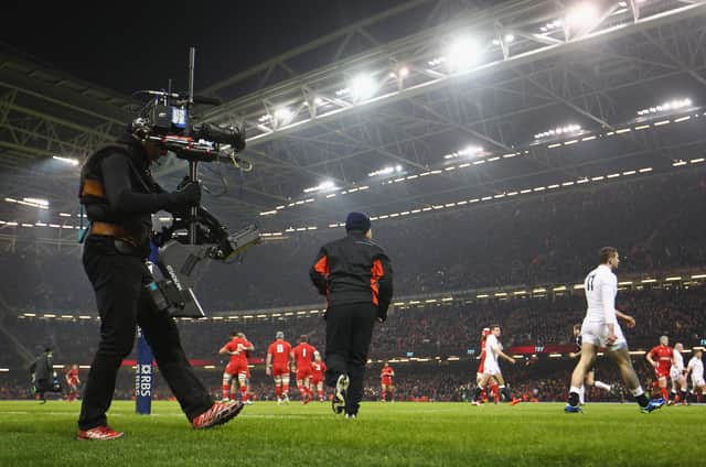 A television cameraman keeps a close eye on play during a Six Nations match between Wales and England