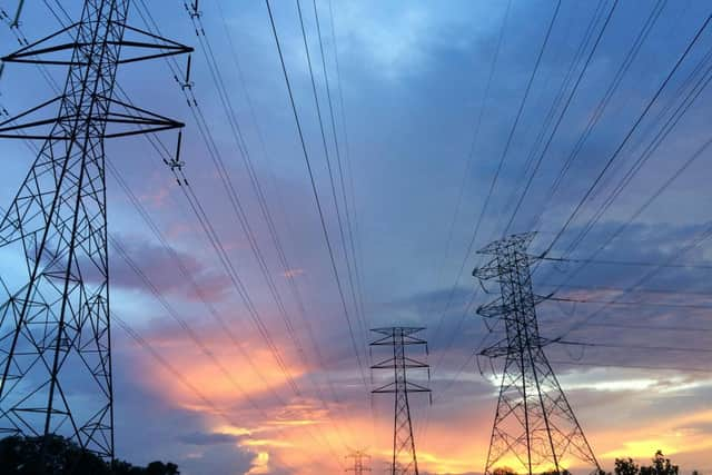 Transmission Towers Under Sky.