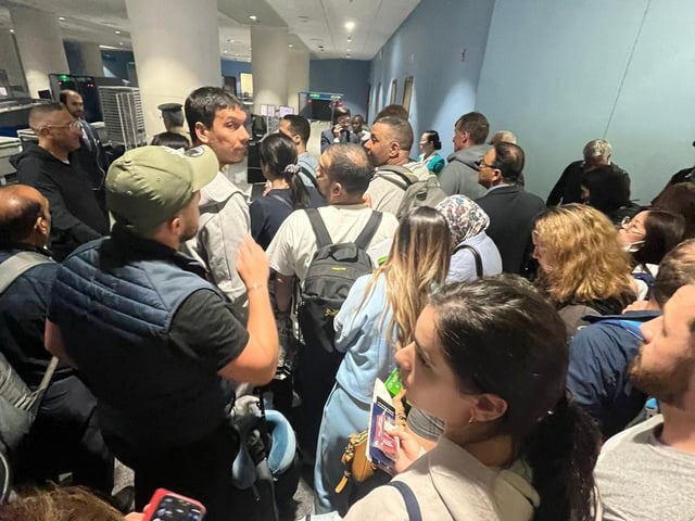Hundreds of people wait at Dubai World Central airport because of flooding caused by the heaviest rain ever recorded in the desert nation.