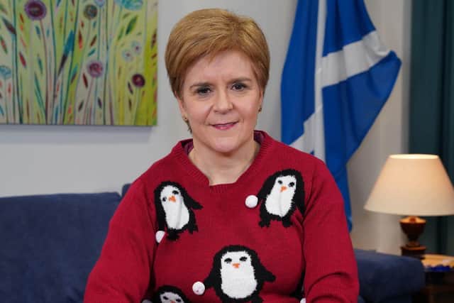 Nicola Sturgeon donned a festive penguin jumper to raise cash to help children across Scotland.