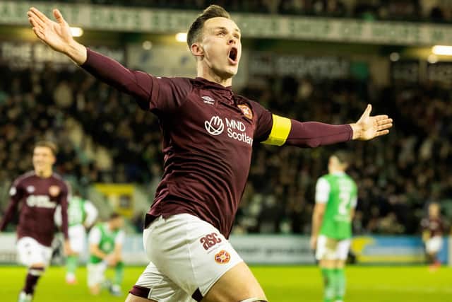 Hearts' Lawrence Shankland (C) celebrates scoring a last minute winner against Hibs at Easter Road. (Photo by Mark Scates / SNS Group)