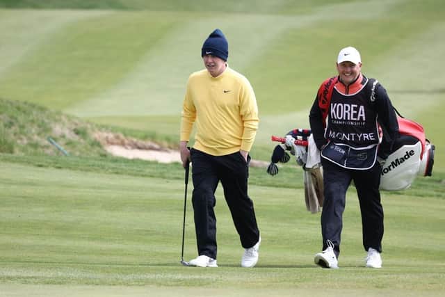 Bob MacIntyre and caddie Mike Thomson pictured during a practice round for the Korea Championship Presented by Genesis at Jack Nicklaus Golf Club Korea. Picture: Chung Sung-Jun/Getty Images.