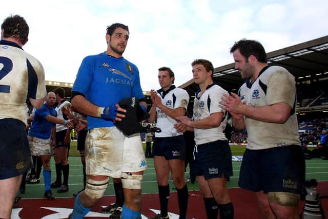 Mike Blair, centre, and Tom Smith, right, alongside Chris Cusiter, applaud Italy's Marco Bortolami after Scotland's win over the Azzurri in the 2005 Six Nations. Picture: Gareth Copley/PA