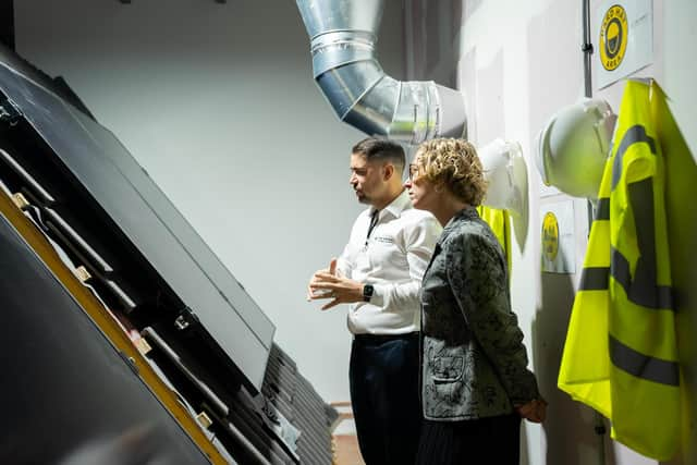 Mark Glasgow, co-founder of the Energy Training Academy, explains some of the innovative technology – including solar panels – on show in the Net Zero Home to green skills minister Lorna Slater