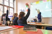 A teacher and students in a classroom. PIC: Ben Birchall/PA Wire