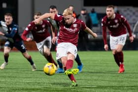 Nicky Low converts from the penalty spot to give Arbroath victory over Raith.