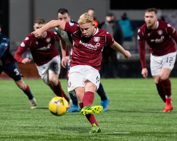 Nicky Low converts from the penalty spot to give Arbroath victory over Raith.