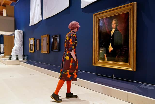 A member of staff walks through the central gallery, as the Burrell Collection in Pollok Country Park, Glasgow, prepares to reopen following its refurbishment. Picture: Jane Barlow/PA