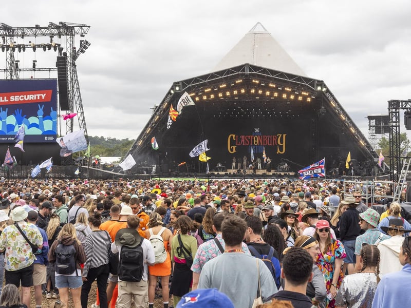 People enjoy the first proper day of Glastonbury Festival as the music gets underway.