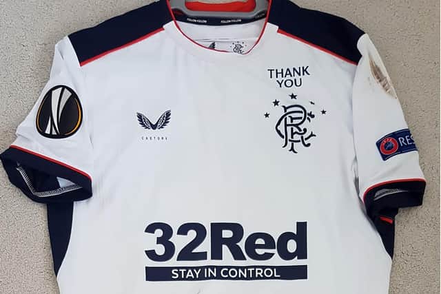 A white Rangers football top with a distinctive "THANK YOU" above the badge which was stolen along with other memorabilia prior to them going up for auction in aid of NHS have been found by police.