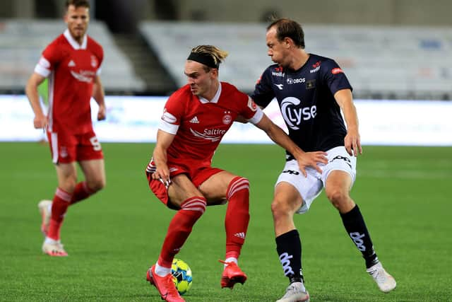 Ryan Hedges shows a neat turn under pressure from Rolf Vikstol of Viking Stavanger.