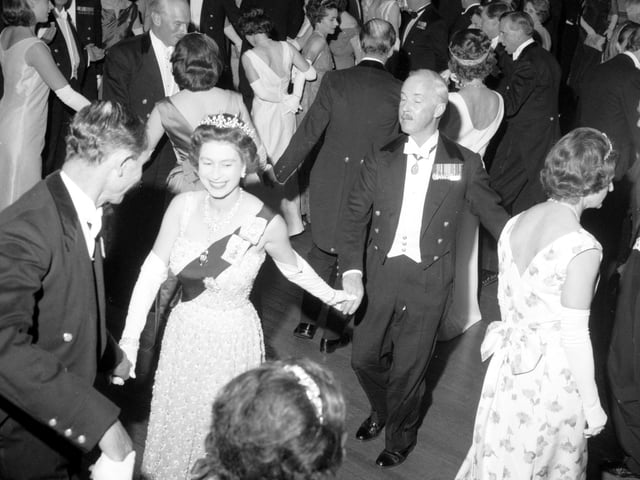 Queen Elizabeth II dances an eightsome reel at the Royal Company of Archers' Ball in the Assembly Rooms, Edinburgh, in 1966.