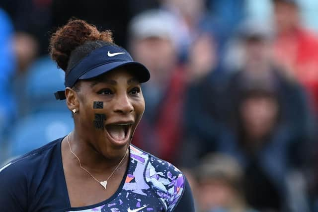 Serena Williams celebrates after winning with Tunisia's Ons Jabeur at Eastbourne International (Photo by GLYN KIRK/AFP via Getty Images)