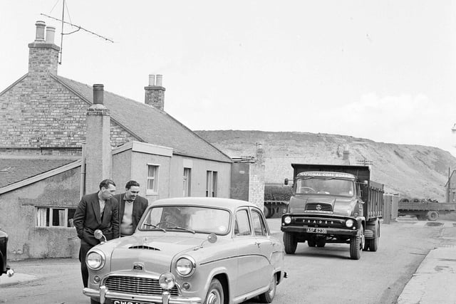 Police escort a lorry through picket line during the Loanhead Colliery drivers strike in May 1964.