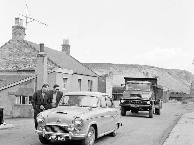 Police escort a lorry through picket line during the Loanhead Colliery drivers strike in May 1964.