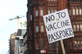 Demonstrators take part in a protest against Covid certification in Belfast city centre at the weekend. First Minister Nicola Sturgeon is expected to announce an extension of the scheme in Scotland on Tuesday. Photo: Dominic McGrath/PA Wire