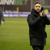 Hibs manager Lee Johnson applauds the fans after his team's 6-0 win over Aberdeen on Saturday. (Photo by Paul Devlin / SNS Group)