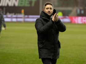 Hibs manager Lee Johnson applauds the fans after his team's 6-0 win over Aberdeen on Saturday. (Photo by Paul Devlin / SNS Group)