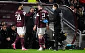Hearts' Michael Smith goes off injured against Celtic on Wednesday.