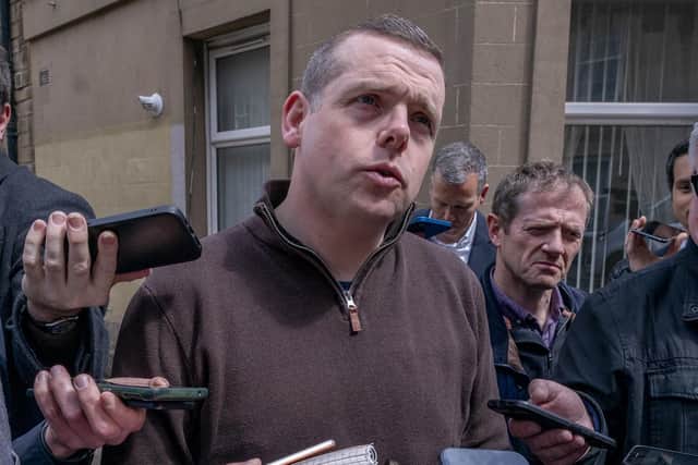 Scottish Conservative leader Douglas Ross speaks to the media in street. Photo: Jane Barlow/PA Wire