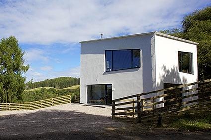 This architect-designed ‘castle'-inspired house is located close to Loch Awe, and boasts lovely views.