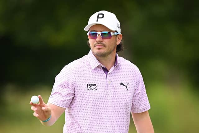 Ewen Ferguson of Scotland acknowledges the crowd following a birdie putt on the 14th green during day two of the BMW International Open at Golfclub Munchen Eichenried. (Photo by Stuart Franklin/Getty Images)