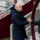 Hearts head coach Steven Naismith (L) and Hibs manager Nick Montgomery shake hands before the derby at Tynecastle earlier this season. Photo by Mark Scates / SNS Group