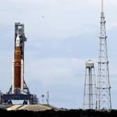 The NASA moon rocket stands ready less than 24 hours before it is scheduled to launch on Pad 39B for the Artemis 1 mission to orbit the moon at the Kennedy Space Center, Sunday, Aug. 28, 2022, in Cape Canaveral, Fla. (AP Photo/John Raoux)