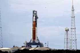 The NASA moon rocket stands ready less than 24 hours before it is scheduled to launch on Pad 39B for the Artemis 1 mission to orbit the moon at the Kennedy Space Center, Sunday, Aug. 28, 2022, in Cape Canaveral, Fla. (AP Photo/John Raoux)