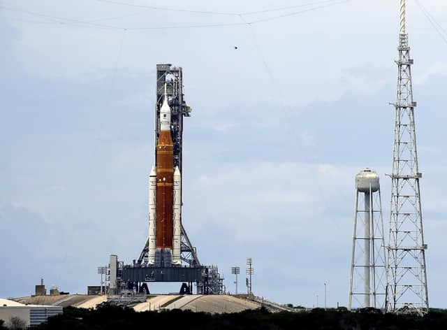The NASA moon rocket stands ready less than 24 hours before it is scheduled to launch on Pad 39B for the Artemis 1 mission to orbit the moon at the Kennedy Space Center, Sunday, Aug. 28, 2022, in Cape Canaveral, Fla. (AP Photo/John Raoux)