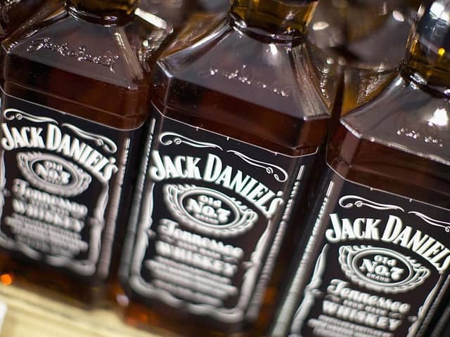 The local business owner claims that damage has been caused to her property by evaporation from bottles of whisky made by the Jack Daniels brand.