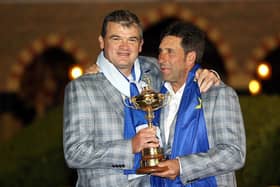 Paul Lawrie celebrates with captain Jose Maria Olazabal after Europe's win in the 2012 Ryder Cup at Medinah. Picture: Ross Kinnaird/Getty Images.
