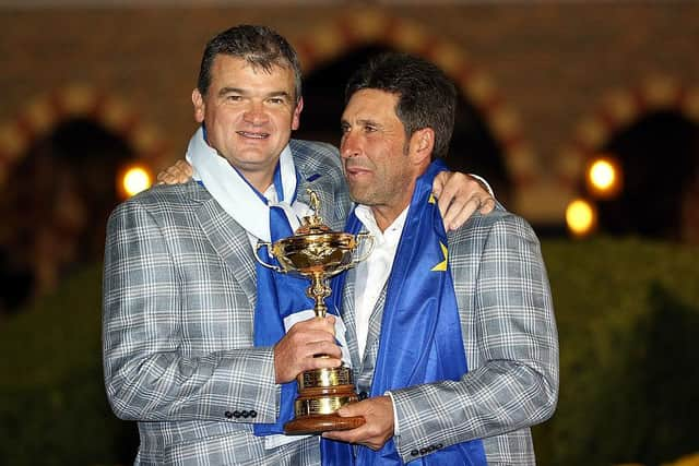 Paul Lawrie celebrates with captain Jose Maria Olazabal after Europe's win in the 2012 Ryder Cup at Medinah. Picture: Ross Kinnaird/Getty Images.