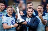 Fraser Brown, centre, after helping Scotland beat France at Murrayfield on his 50th appearance for the national team, during the 2020 Six Nations. He is flanked by Kyle Steyn and Chris Harris. (Photo by Ross Parker / SNS Group)