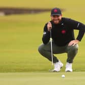 Tyrrell Hatton smiles as he lines up a putt on the first green at St Andrews during day three of the Alfred Dunhill Links Championship. Picture: Kate McShane/Getty Images.