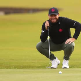 Tyrrell Hatton smiles as he lines up a putt on the first green at St Andrews during day three of the Alfred Dunhill Links Championship. Picture: Kate McShane/Getty Images.