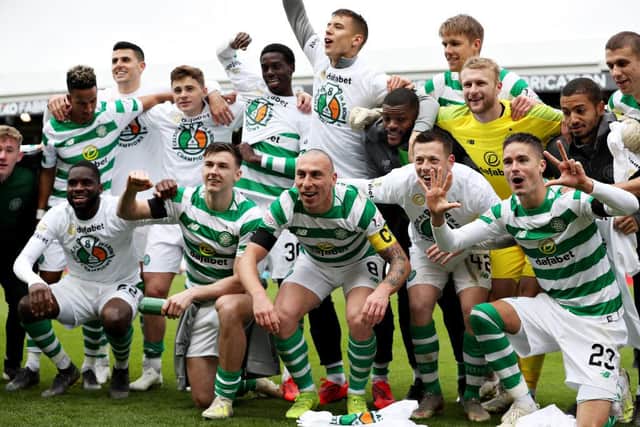 Celtic celebrate winning the title last season. Picture: SNS