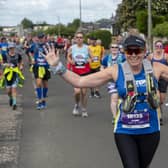 Runners in the Edinburgh full Marathon run through the four mile mark in the Craigentinny area of the City on Sunday morning.