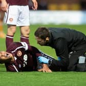 Hearts defender Toby Sibbick screams in pain during the match against Motherwell.