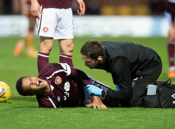Hearts defender Toby Sibbick screams in pain during the match against Motherwell.
