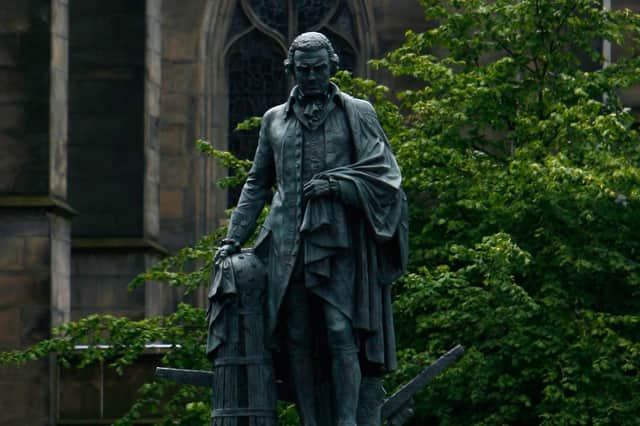 The bronze statue of Scottish economist Adam Smith in Edinburgh