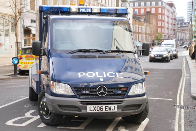 An armoured police van, which arrived with a police escort carrying David Smith, enters Westminster Magistrates' Court, London, where he is charged with nine offences under the Official Secrets Act following his extradition from Germany.