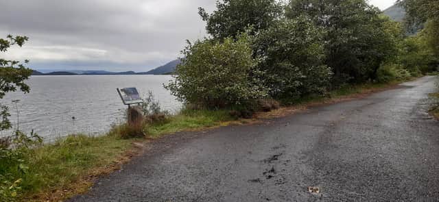 The remains of a cat's eye is one of the last signs the cycle path was formerly a main road. Picture: The Scotsman