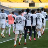 Leeds United players wear T-shirts with slogans against a proposed new European Super League during the warm up for a match against Liverpool (Picture: Clive Brunskill/pool/AFP via Getty Images)
