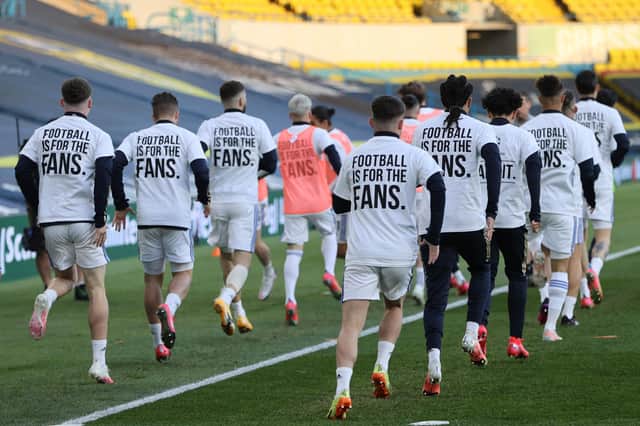 Leeds United players wear T-shirts with slogans against a proposed new European Super League during the warm up for a match against Liverpool (Picture: Clive Brunskill/pool/AFP via Getty Images)