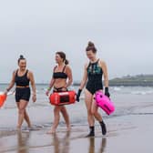 Sam Petrie, Hayley Dorian and Naomi Brehm from the Wild Sea Women swimming group get ready for a dip in the sea at Seaburn beach in Sunderland -- the women have been taking part in a unique study which sought to identify biological changes in the body caused by exposure to cold water. Picture: David Wood