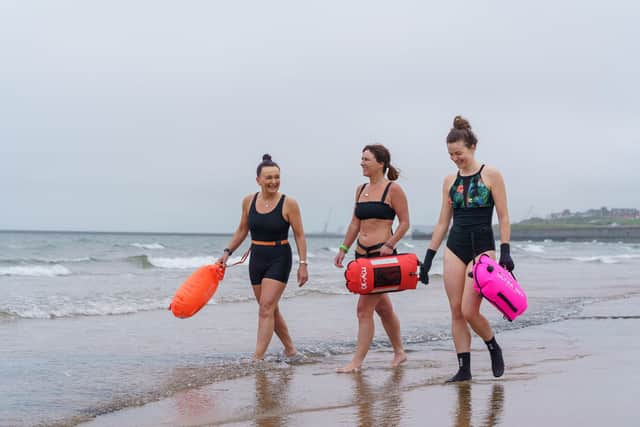 Sam Petrie, Hayley Dorian and Naomi Brehm from the Wild Sea Women swimming group get ready for a dip in the sea at Seaburn beach in Sunderland -- the women have been taking part in a unique study which sought to identify biological changes in the body caused by exposure to cold water. Picture: David Wood